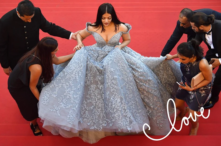 Aishwarya Rai Bachchan in an elaborate Micheal Cinco outfit at the Cannes 2017, with her entourage. 
