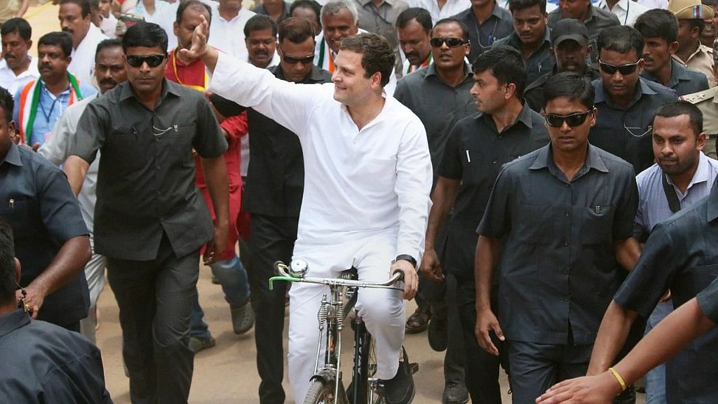 Congress President Rahul Gandhi rides a bicycle to protest against the fuel price hike at Malur in Kolar district on Monday.
