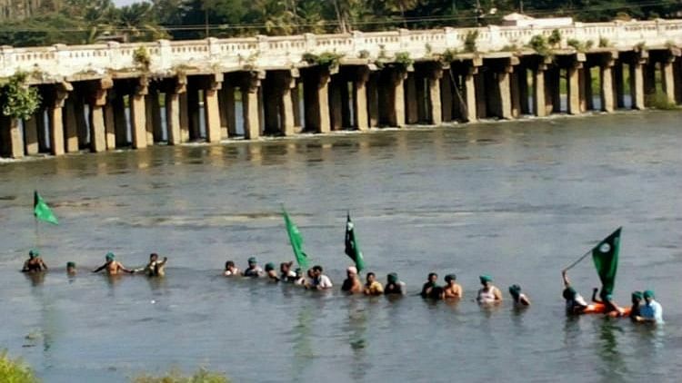 Protesters gathered at the Cauvery river.