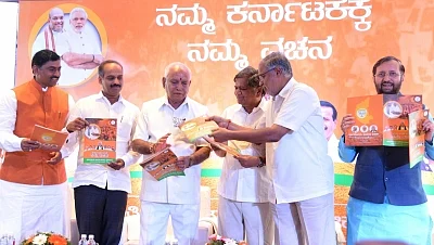 Bengaluru: Karnataka BJP president B S Yeddyurappa releases party manifesto for the upcoming assembly election with Union Minister Prakash Javadekar, Karnataka BJP in-charge Muralidhar Rao, MP PC Mohan, MLAs Jagadish Shetter and Suresh Kumar in Bengaluru on May 4, 2018. (Photo: IANS)