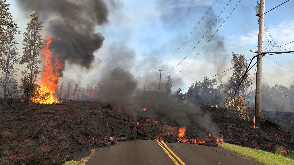 Lava slowly advances to  Hookapu Street in the Leilani Estates of Hawaii.