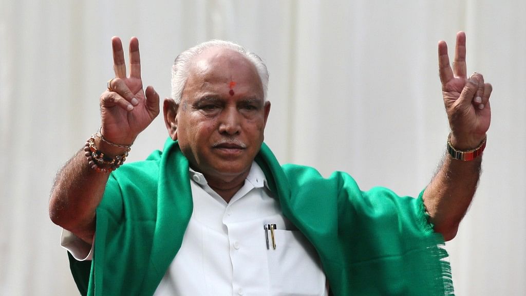 BJP’s BS Yeddyurappa flashes victory sign after he was sworn in as chief minister of Karnataka in Bangalore.