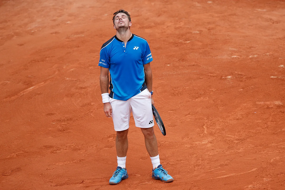 Switzerland’s Stan Wawrinka misses a return against Spain’s Guillermo Garcia-Lopez during their first round match of the French Open tennis tournament at the Roland Garros stadium in Paris, France, Monday, May 28, 2018. Wawrinka lost in five sets 6-2, 3-6, 4-6, 7-6 (7-5), 6-3. 