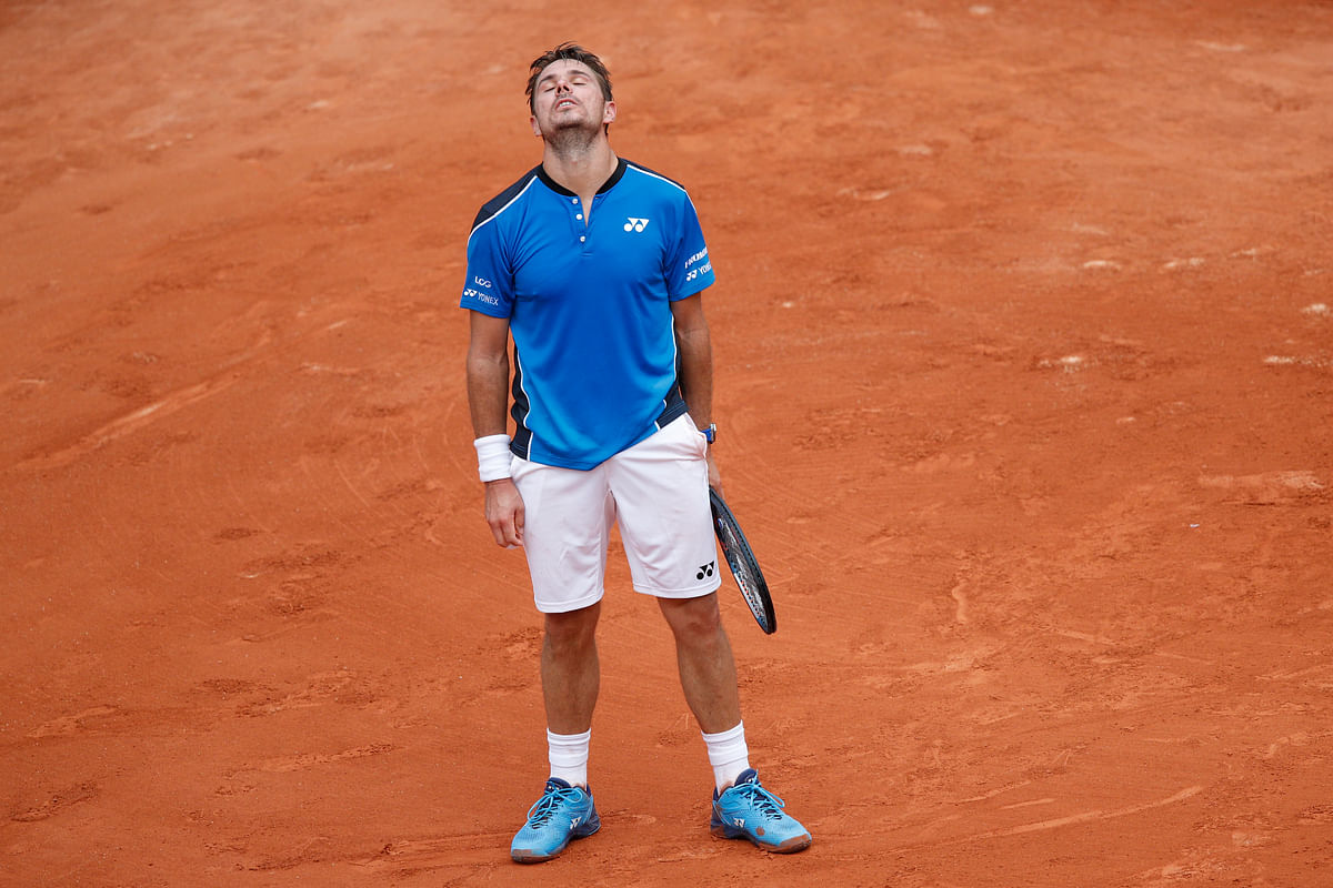 Novak Djokovic launched his campaign for a second French Open title with a moody victory over Rogerio Dutra Silva.