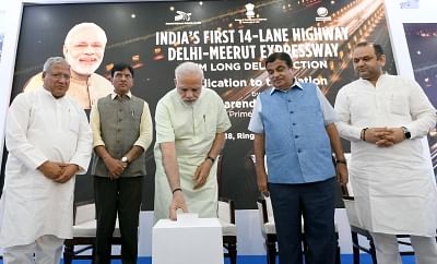 New Delhi: Prime Minister Narendra Modi along with Union Ministers Nitin Gadkari and Mansukh L Mandaviya, inaugurates the first phase of Delhi Meerut Expressway, in New Delhi on May 27, 2018. The first phase of the Delhi-Meerut Expressway cost Rs 842 crore on building the 9-km stretch of the 14-lane highway. Once the entire project is complete, it will take 60 minutes to travel from Delhi to Meerut. (Photo: IANS/PIB)