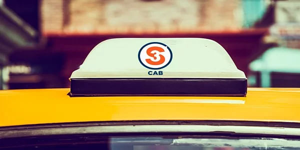 A taxi shows the logo of the new startup called S3 Cab launched in Mumbai.
