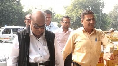 Rotomac owner Vikram Kothari and his son Rahul Kothari being taken away to be produced before the Patiala House Court in New Delhi, on 25 Feb 2018.