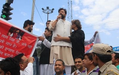 Jammu: Former Jammu and Kashmir Minister Choudhary Lal Singh addresses during a protest march organised to press for a CBI probe in the Kathua rape and murder case; in Jammu on April 17, 2018. Singh stepped down as the Forest Minister along with Chander Prakash Ganga, who held the industries portfolio in the PDP-BJP government, after a public outcry over their participation in Hindu Ekta Manch rally which was held in defence of the accused in the crime. (Photo: IANS)