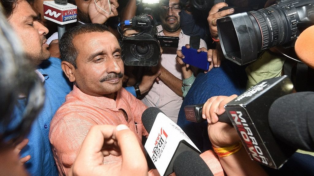 BJP MLA from Unnao Kuldeep Singh Sengar, accused in a rape case, surrounded by media persons outside the office of the Senior Superintendent of Police in Lucknow.