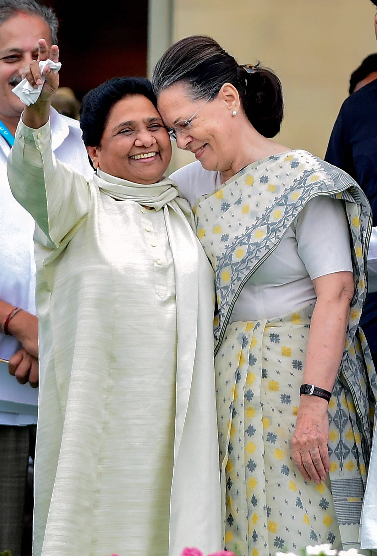 Sonia Gandhi and Mayawati share a hug.