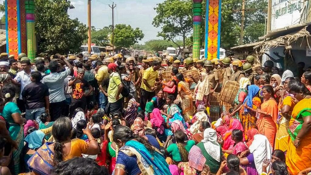 Police personnel tackle the agitators demanding the closure of Vedanta’s Sterlite Copper unit in Thoothukudi, as protest entered the 100th day on Tuesday, 22 May.