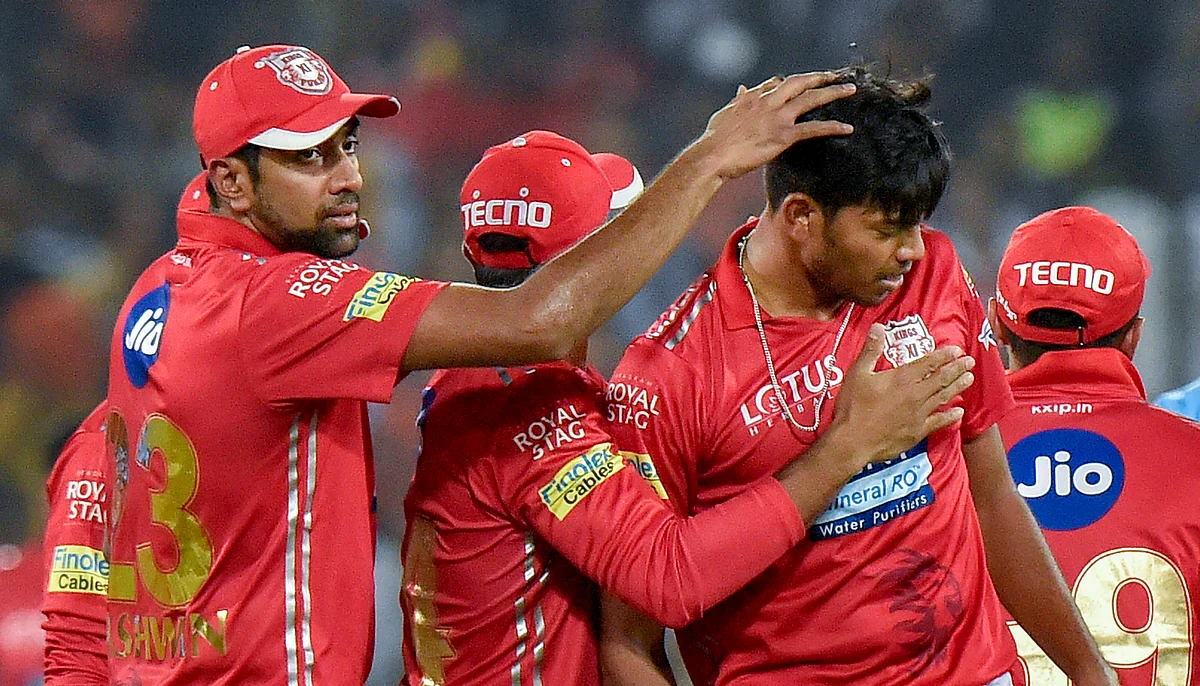 Ankit Rajpoot is congratulated by Ravichandran Ashwin for taking a wicket.