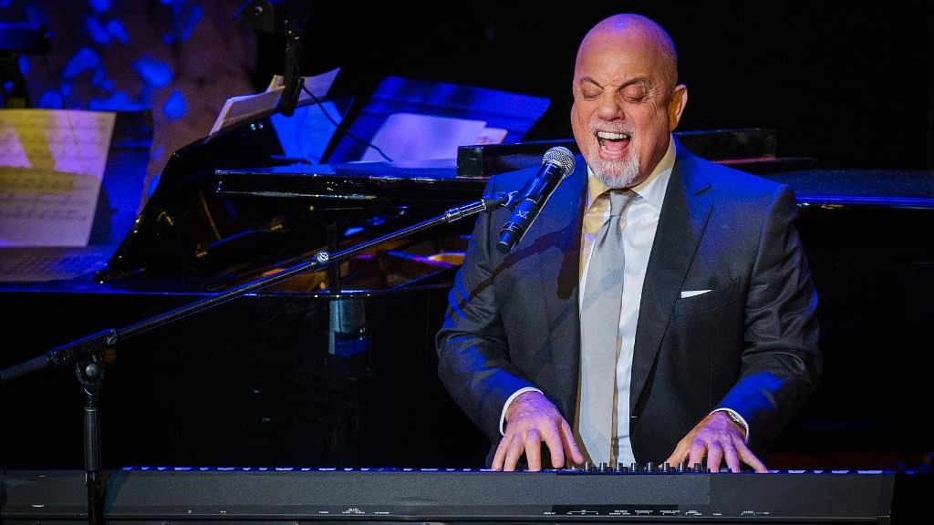 Billy Joel performs after accepting an award at the American Society of Composers, Authors and Publishers in 2014.