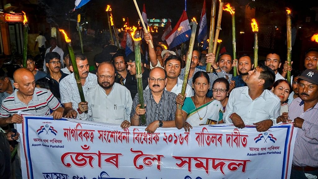 Activists of Asom Gana Parishad (AGP) led by former Assam chief minister Prafulla Kumar Mahanta take out a torch light rally objecting to Citizenship (Amendment) Bill, 2016 in Guwahati.&nbsp;