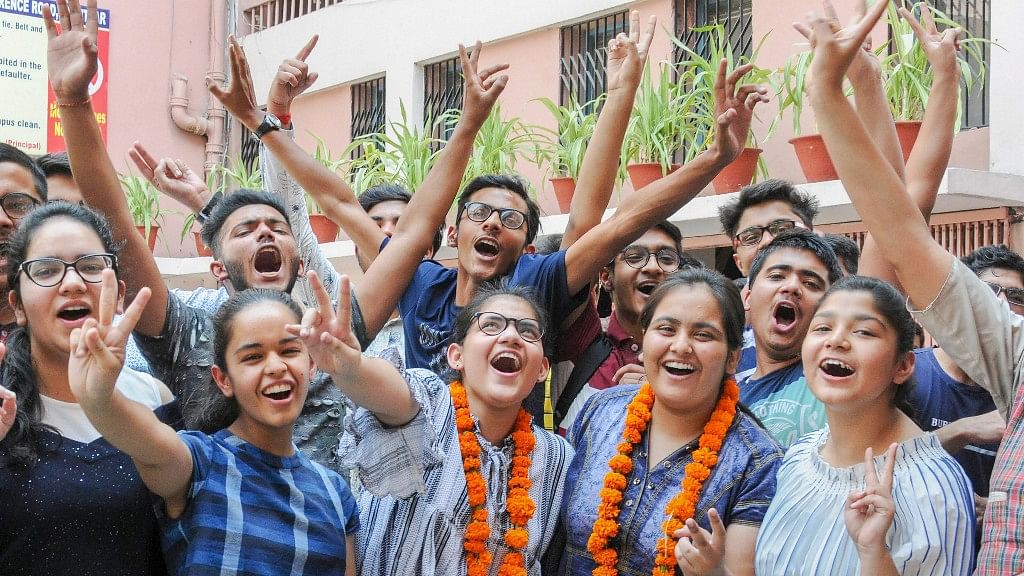 Students celebrate after the results of CBSE Class 10 were announced, in Amritsar.