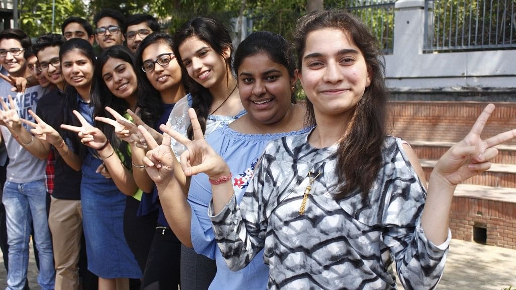 Students celebrate after the Central Board of Secondary Education (CBSE) declared results of the class 12 examinations, in Gurugram on 26 May 2018. 