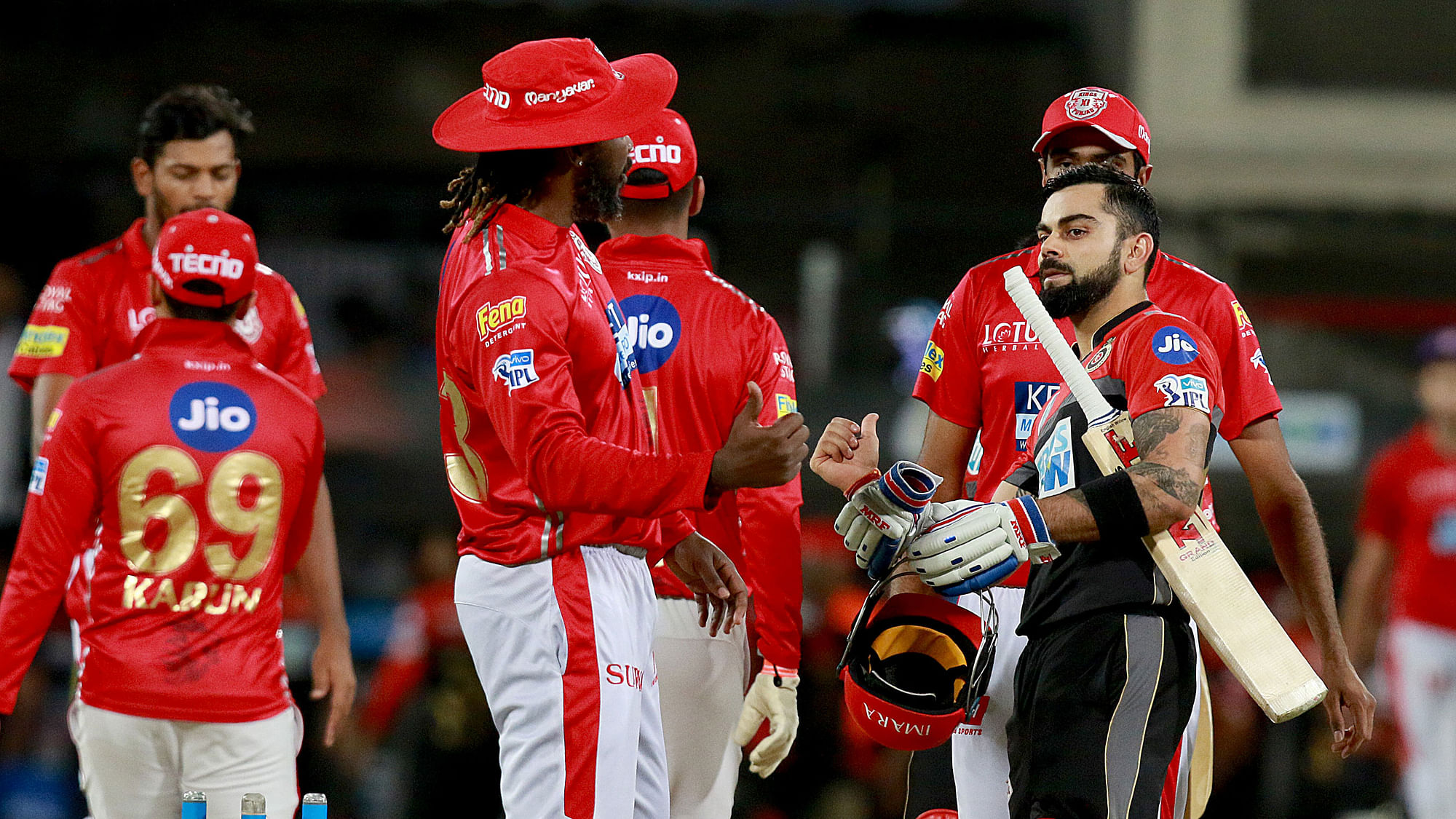 Virat Kohli shares a light moment with Chris Gayle after the match between Kings XI Punjab and Royal Challengers Bangalore.
