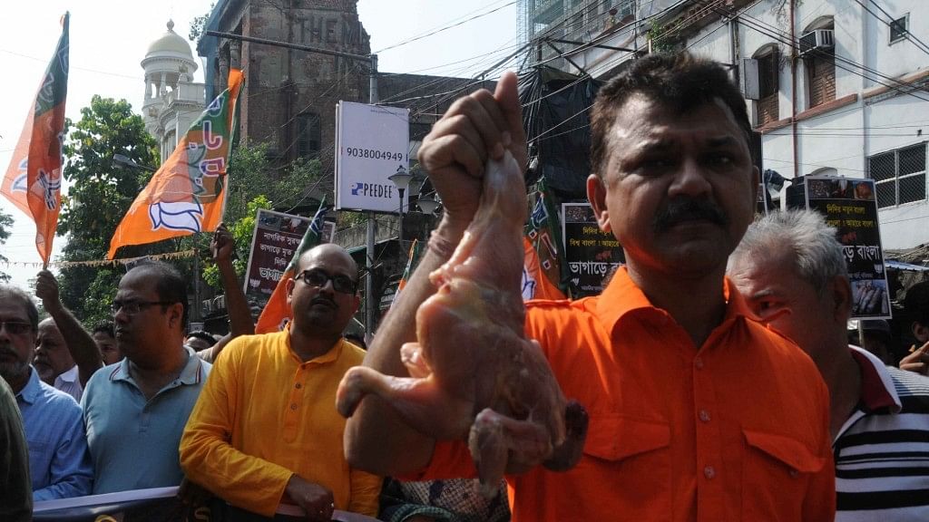 BJP workers stage a demonstration after a racket of rotten meat suppliers was busted, in Kolkata on 3 May, 2018.