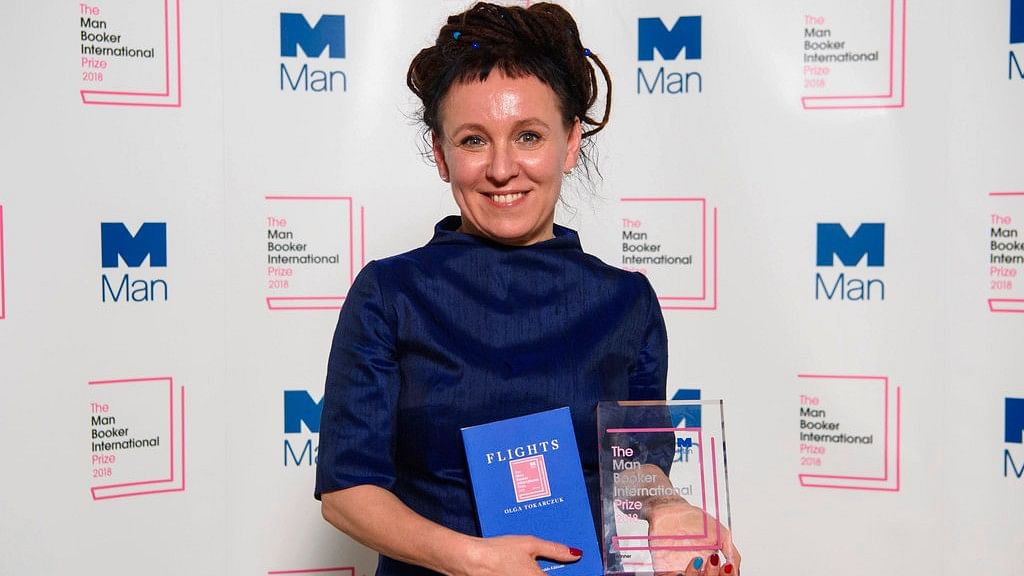 Polish author Olga Tokarczuk smiles after winning the Man Booker International prize 2018, Tuesday, 22 May, 2018, for her book Flights, at the Victoria and Albert Museum in London.   