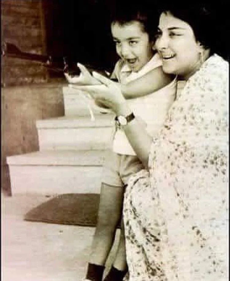 Nargis playing with Sanjay.