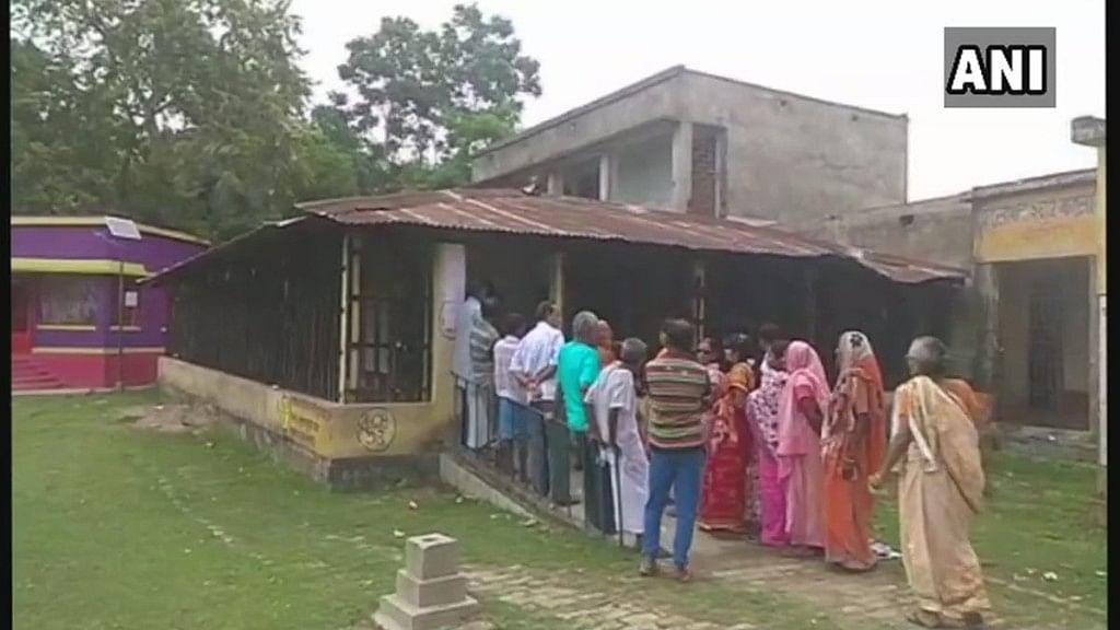 Voters queue up outside a polling booth in West Bengal.&nbsp;