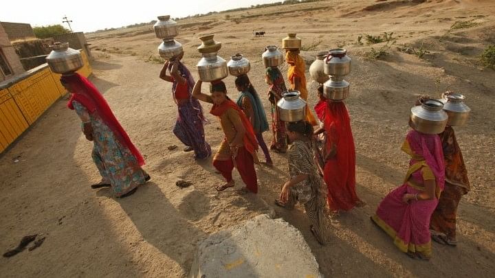 File photo: Women carry pitchers of water in Rajasthan.