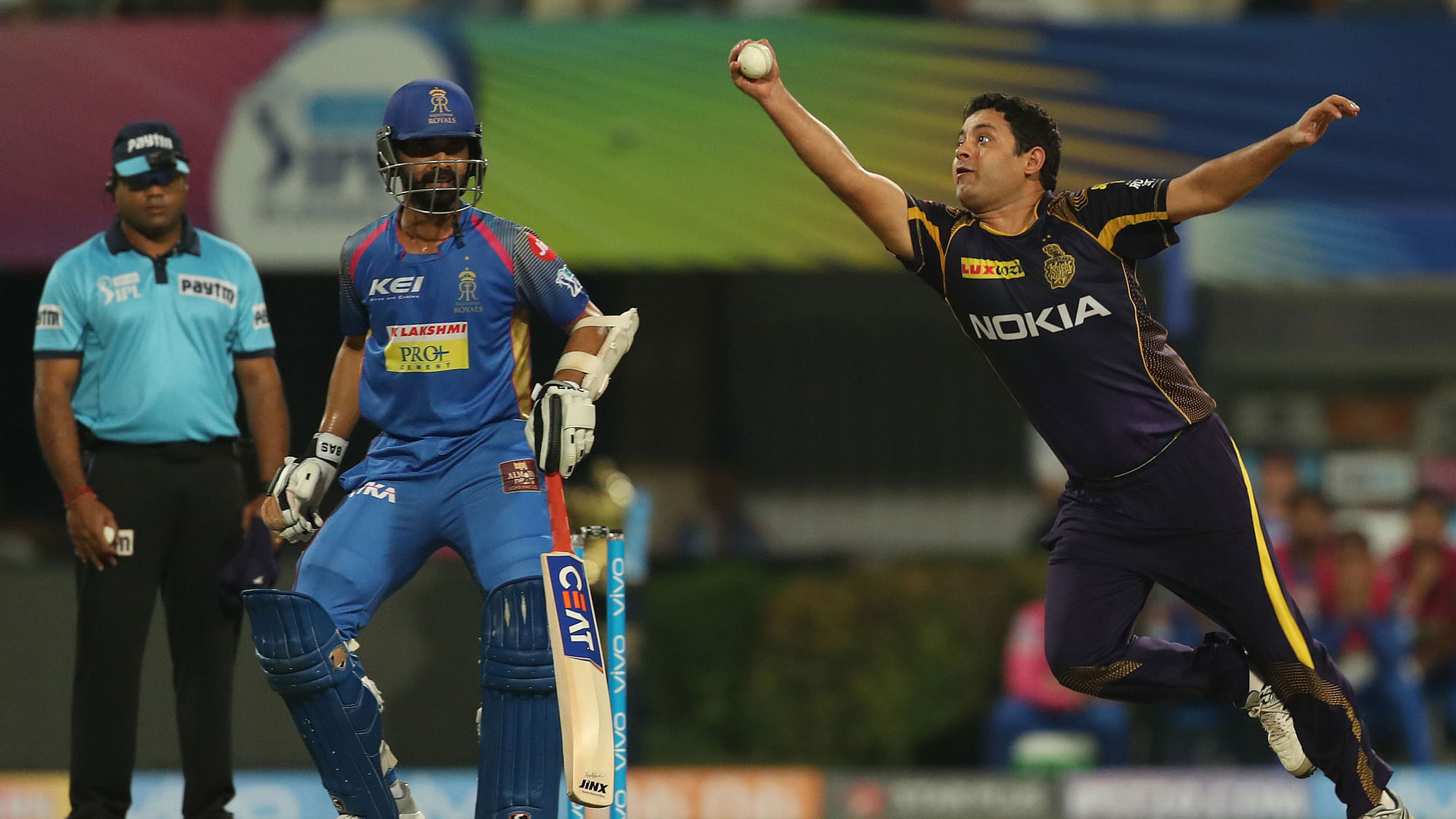 Piyush Chawla takes a catch to dismiss Rahul Tripathi off his own bowling.