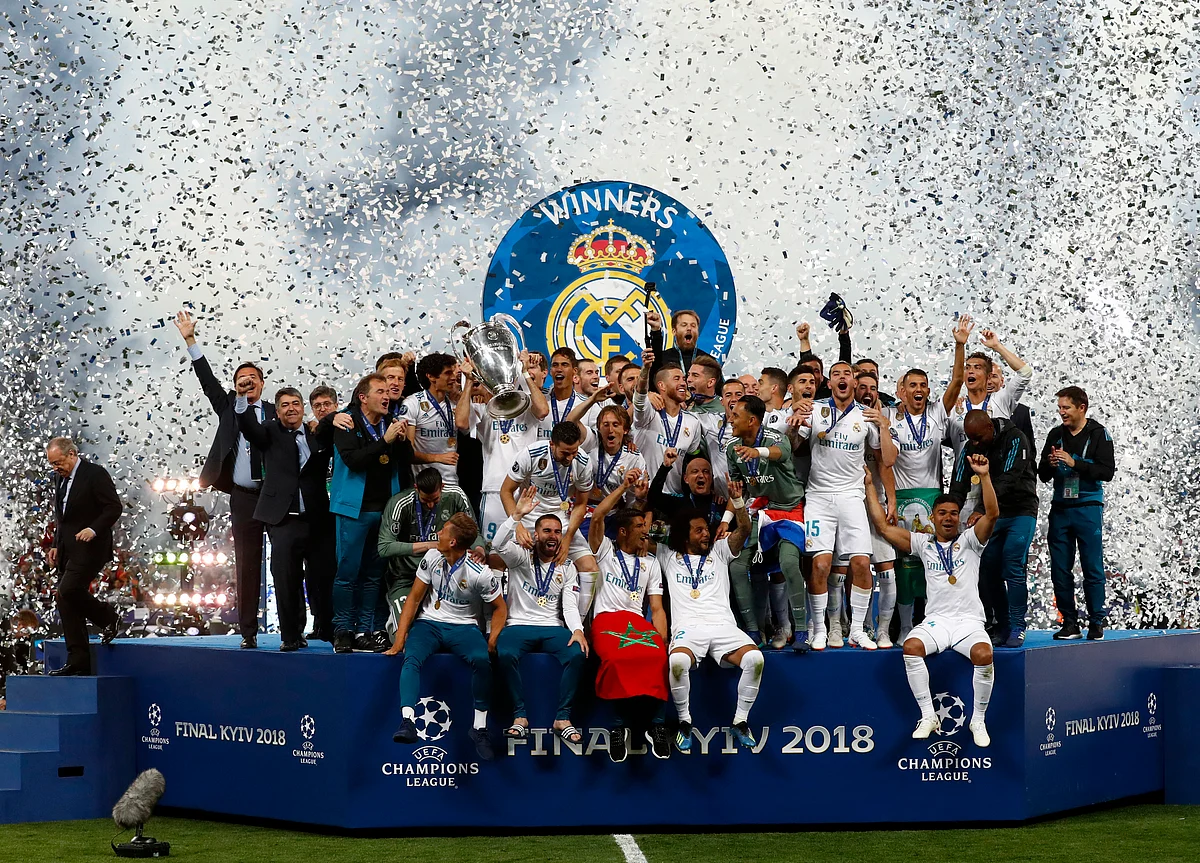 Real Madrid players celebrate with the trophy after winning the Champions League Final in Kiev.