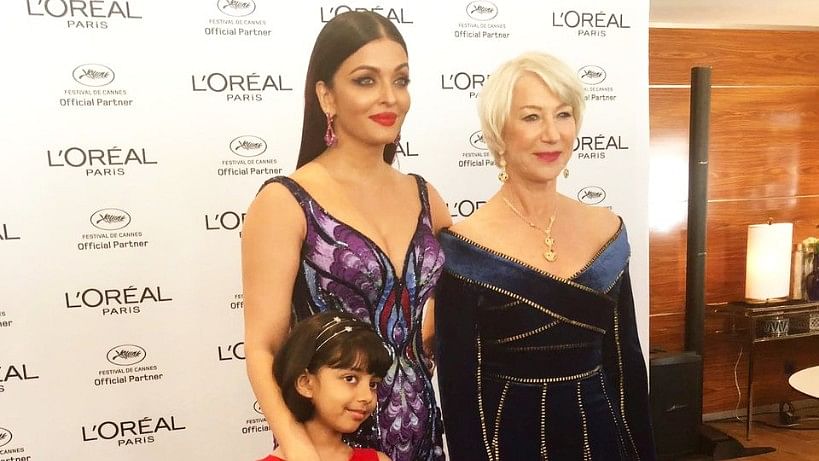Aishwarya and Aaradhya Bachchan with Dame Helen Mirren on the Cannes red carpet.&nbsp;