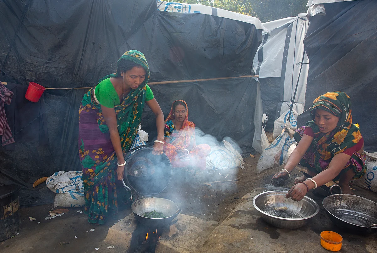 In this 19 January 2018, file photo, Hindu women refugees prepare supper at their camp near Cox’s Bazar, Bangladesh.