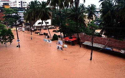Mangaluru: A view of flooded roads of Mangaluru after heavy rains as monsoon entered early to the Karnataka on May 29, 2018. (Photo: IANS)