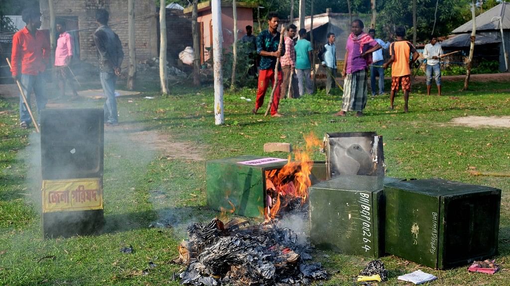 Unknown people burn ballot boxes after snatching them from a polling booth  in Malda district of West Bengal