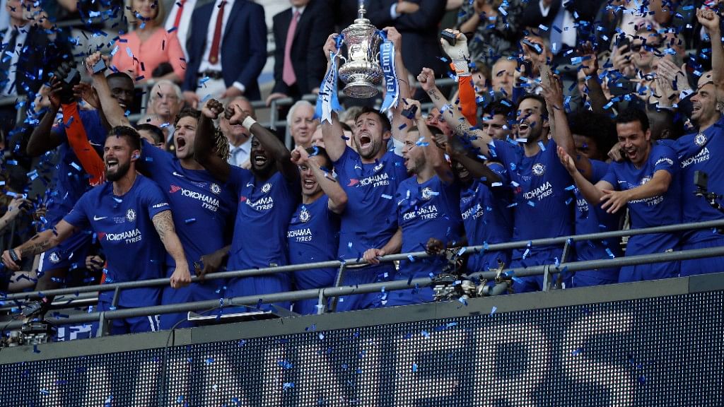 Chelsea captain Gary Cahill lifts the trophy after winning the English FA Cup final against Manchester United at Wembley stadium in London on Saturday.