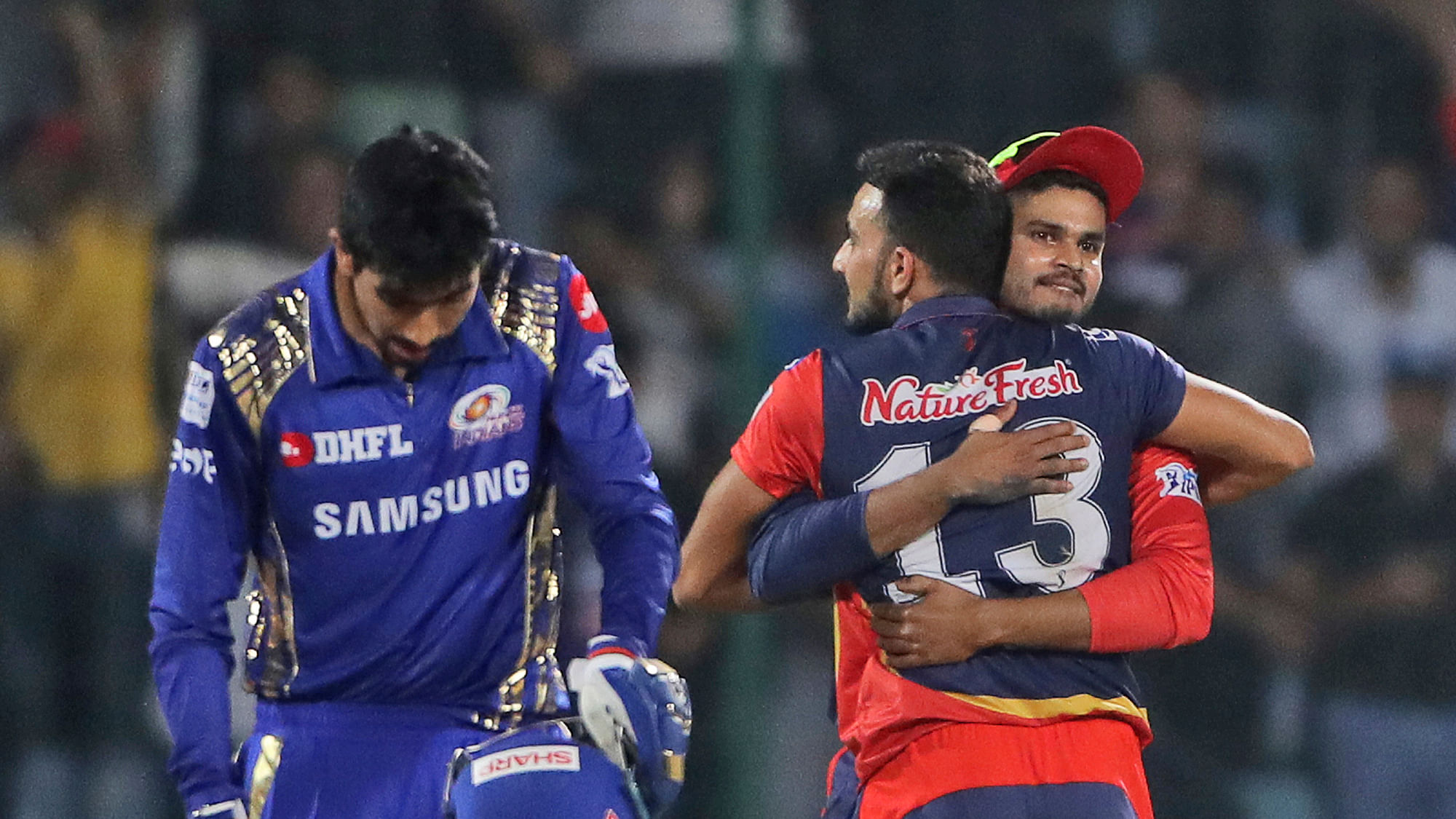 Delhi Daredevils captain Shreyas Iyer, right, hugs his teammate Harshal Patel after beating defending champions Mumbai Indians.
