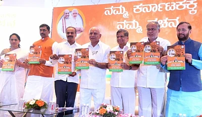 Bengaluru: Karnataka BJP president B S Yeddyurappa releases party manifesto for the upcoming assembly election with Union Minister Prakash Javadekar, Karnataka BJP in-charge Muralidhar Rao, MP PC Mohan, MLAs Jagadish Shetter and Suresh Kumar in Bengaluru on May 4, 2018. (Photo: IANS)