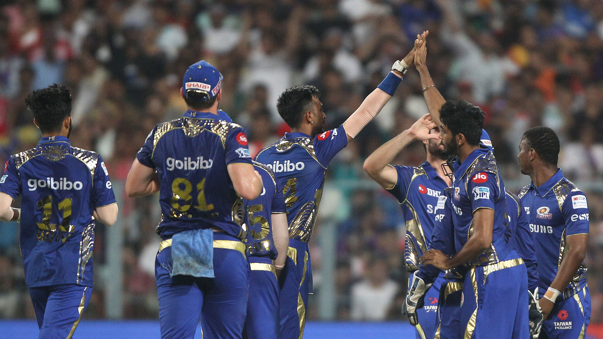The Mumbai Indians celebrate the wicket of Chris Lynn of the Kolkata KnightRiders during match forty one of the Vivo Indian Premier League 2018 (IPL 2018) between the Kolkata Knightriders and the Mumbai Indians held at the Eden Gardens Cricket Stadium in Kolkata on the 9th May 2018.