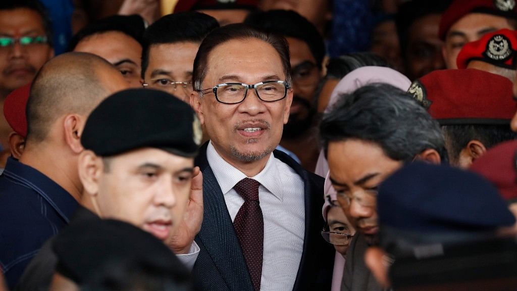 Malaysia’s jailed Opposition icon Anwar Ibrahim surrounded by supporters as he leaves a hospital in Kuala Lumpur, Malaysia.