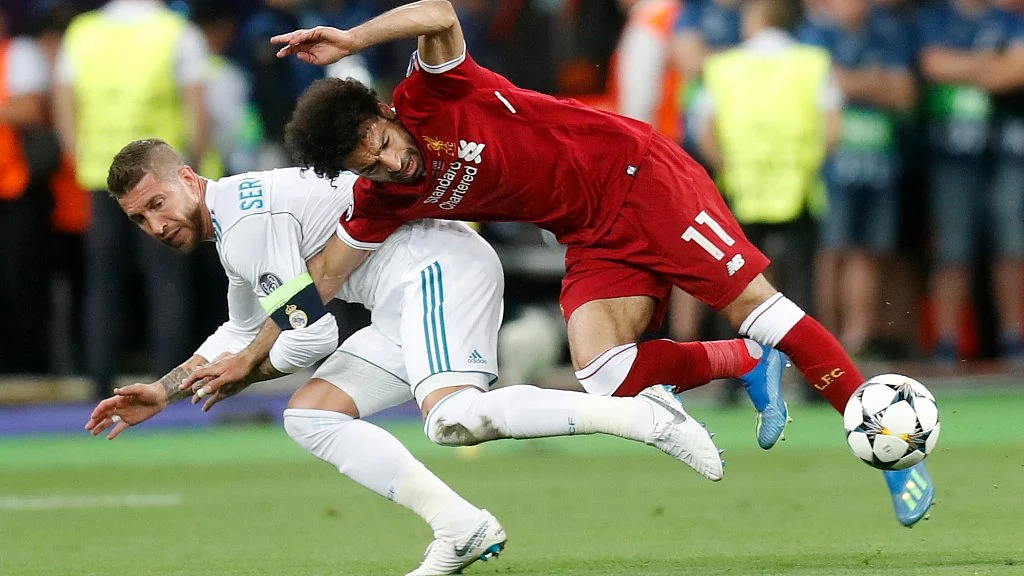 Ramos had grabbed Salah chasing the ball and held on to his right arm and in their twisting fall, the Egypt forward landed heavily on his left shoulder.