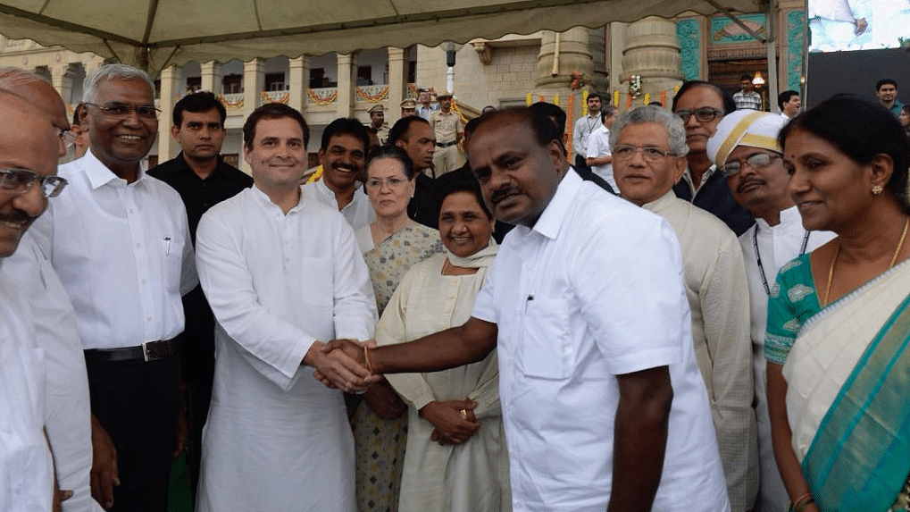Congress President Rahul Gandhi greets Karnataka CM HD Kumaraswamy, as Mayawati and Sitaram Yechury look on.&nbsp;