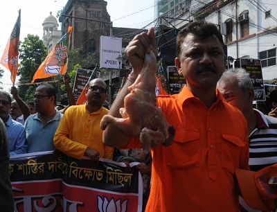 Kolkata: BJP workers stage a demonstration after a racket of rotten meat suppliers was busted, in Kolkata on May 3, 2018. (Photo: IANS)