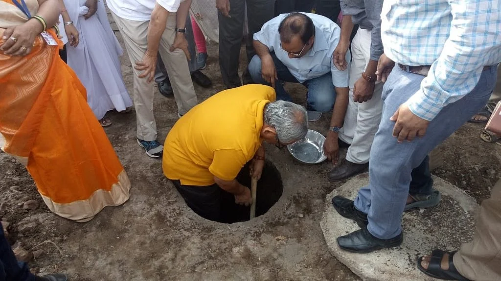 CAG Rajiv Mehrishi Empties Toilet Pit to Break Sanitation Taboos