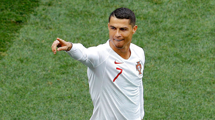 Cristiano Ronaldo celebrates after scoring a goal against Morocco.