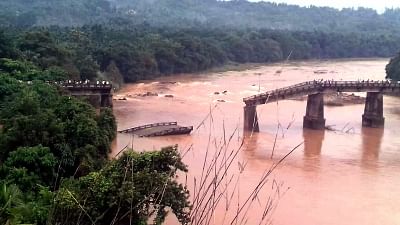 Mangaluru: An old bridge at Mularpatna connecting Mangaluru taluk to Bantwal across Phalguni River collapsed following heavy rains, in Mangaluru on June 25, 2018. (Photo: IANS)