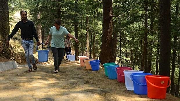 Residents of Shimla collecting water during recent water crisis.
