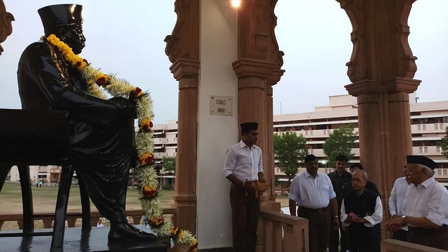 Former President Pranab Mukherjee pays his respects to RSS founder KB Hedgewar.