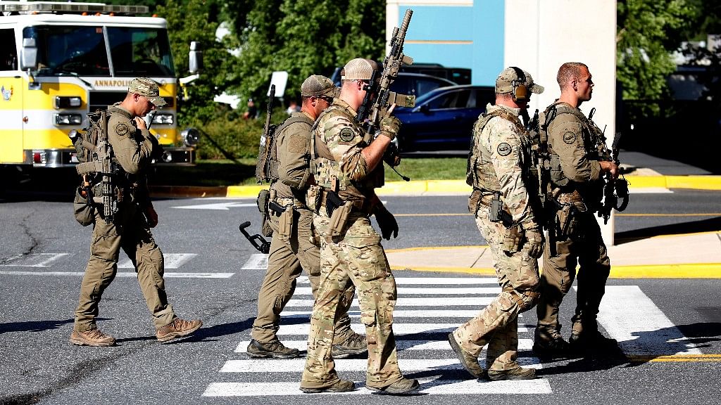 Special tactical police gather after a gunman opened fire at the Capital Gazette newspaper, killing at least five people and injuring several others in Annapolis, Maryland, US