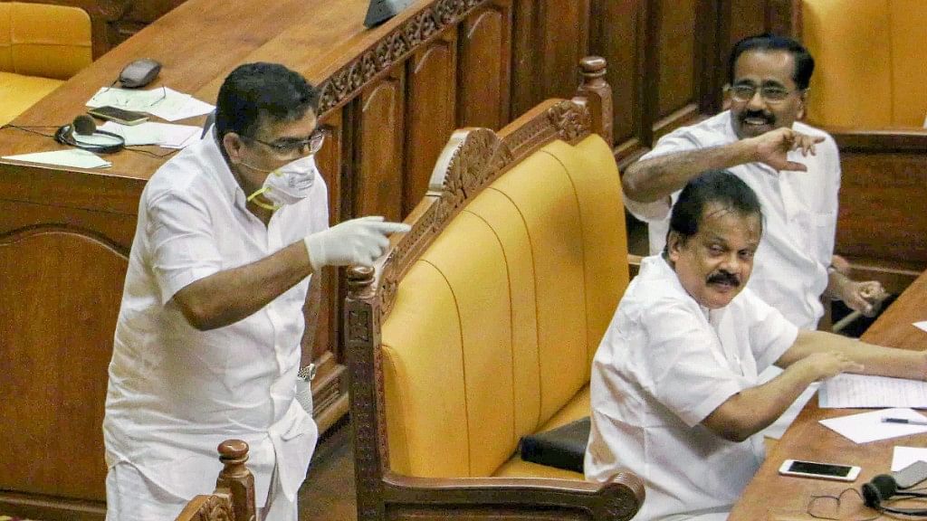 IUML MLA Parakkal Abdullah arrives in the Kerala Assembly, wearing a mask and gloves to seek attention of the house towards the outbreak of Nipah virus, in Thiruvananthapuram on Monday.