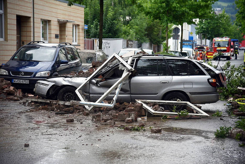 A car is destroyed after an explosion of a house in Wuppertal, Germany, 24 June, 2018.