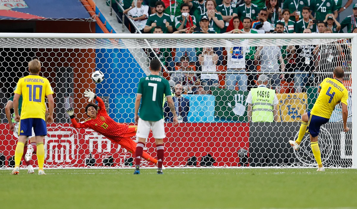Sweden’s Andreas Granqvist (right) puts in a penalty to score his side’s second goal during their Group F match against Mexico at the Yekaterinburg Arena on Wednesday.
