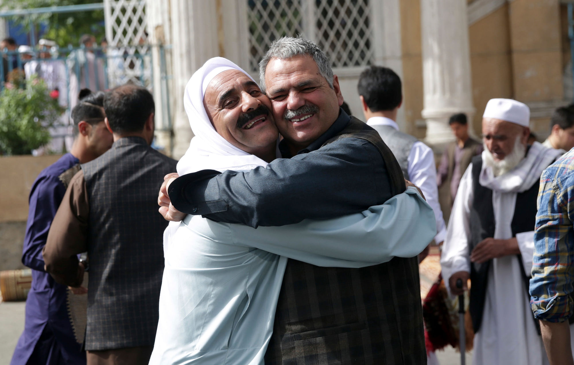 Men hug each other after Eid al-Fitr prayers outside of Shah-e-Dushamshera mosque in Kabul, Afghanistan. Image used for representational purposes.